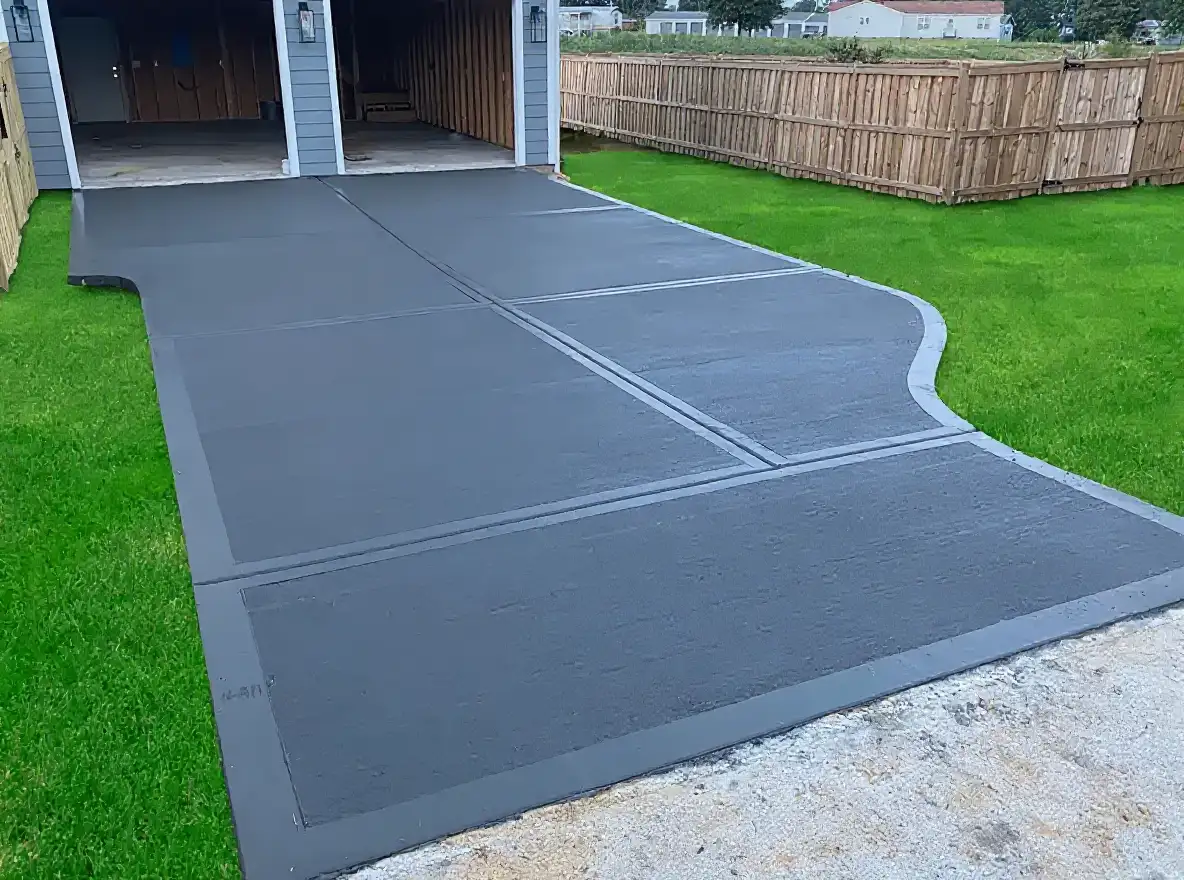 Broom finish concrete driveway ranch home — Ford Concrete design idea