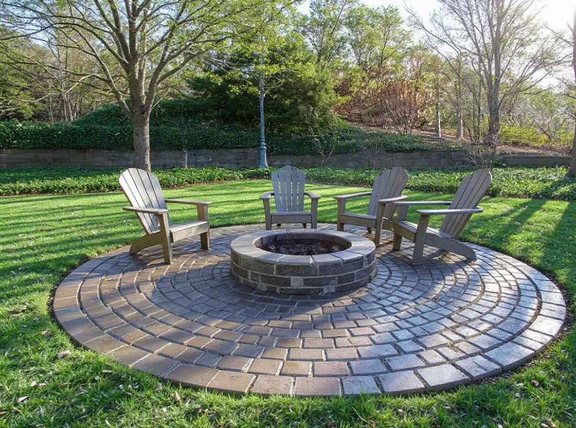 Stamped concrete patio cobblestone with fire pit — Ford Concrete design idea