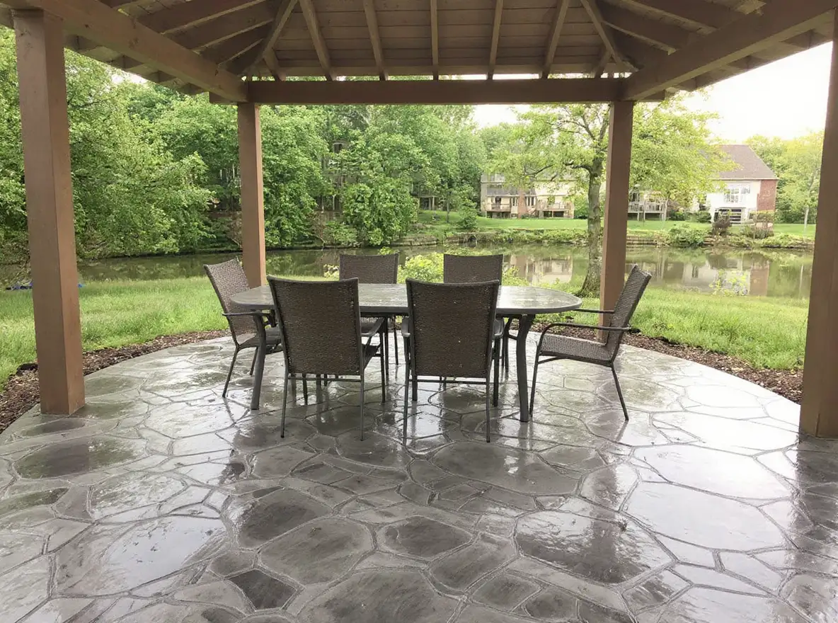 Stamped concrete patio flagstone outdoor dining — Ford Concrete design idea