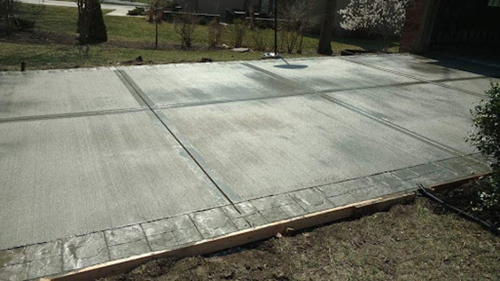 Concrete driveway contractor Kansas City — fresh pour with control joints | Ford Concrete