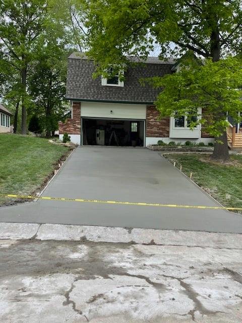 Concrete driveway through wooded lot Kansas City — custom installation | Ford Concrete