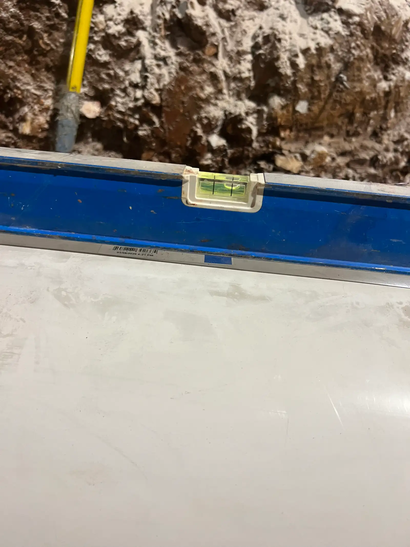 Concrete quality check Kansas City — spirit level verification | Ford Concrete