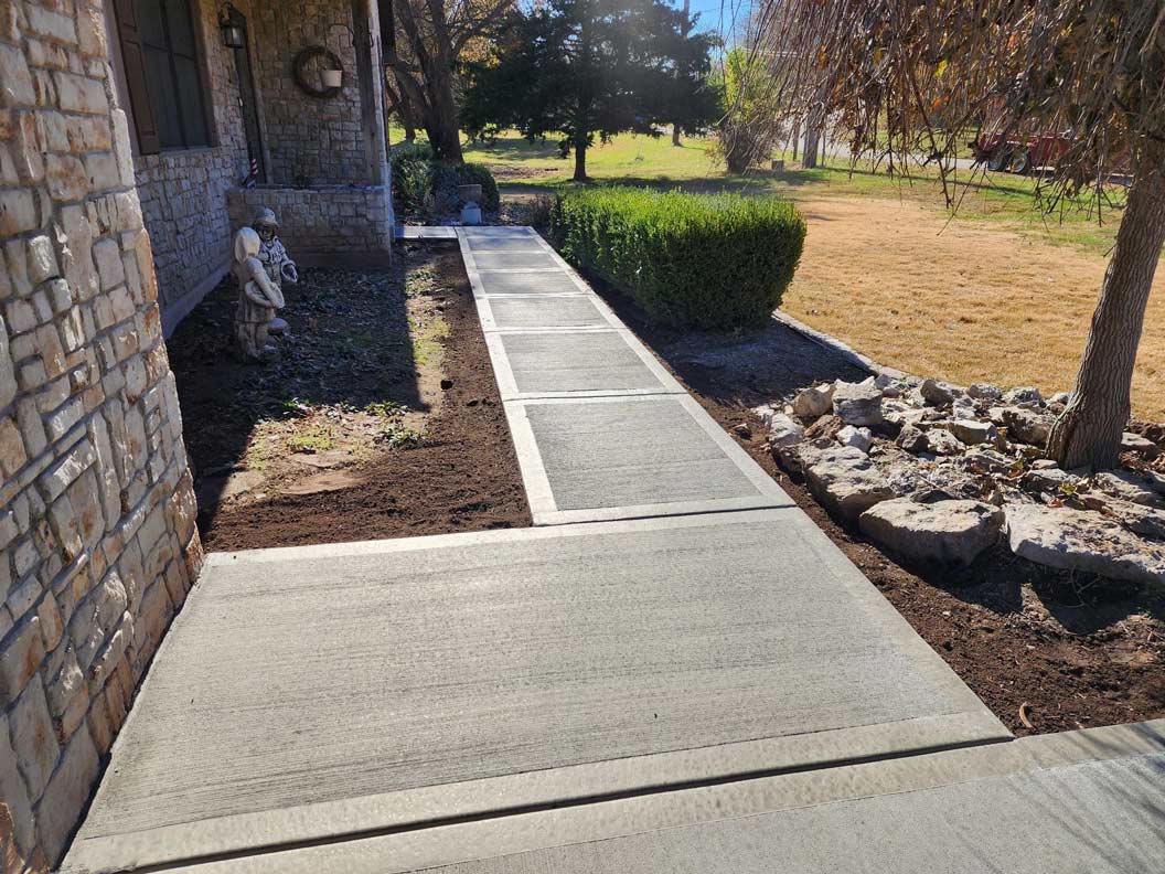 Residential concrete walkway Kansas City — broom-finished front walk | Ford Concrete